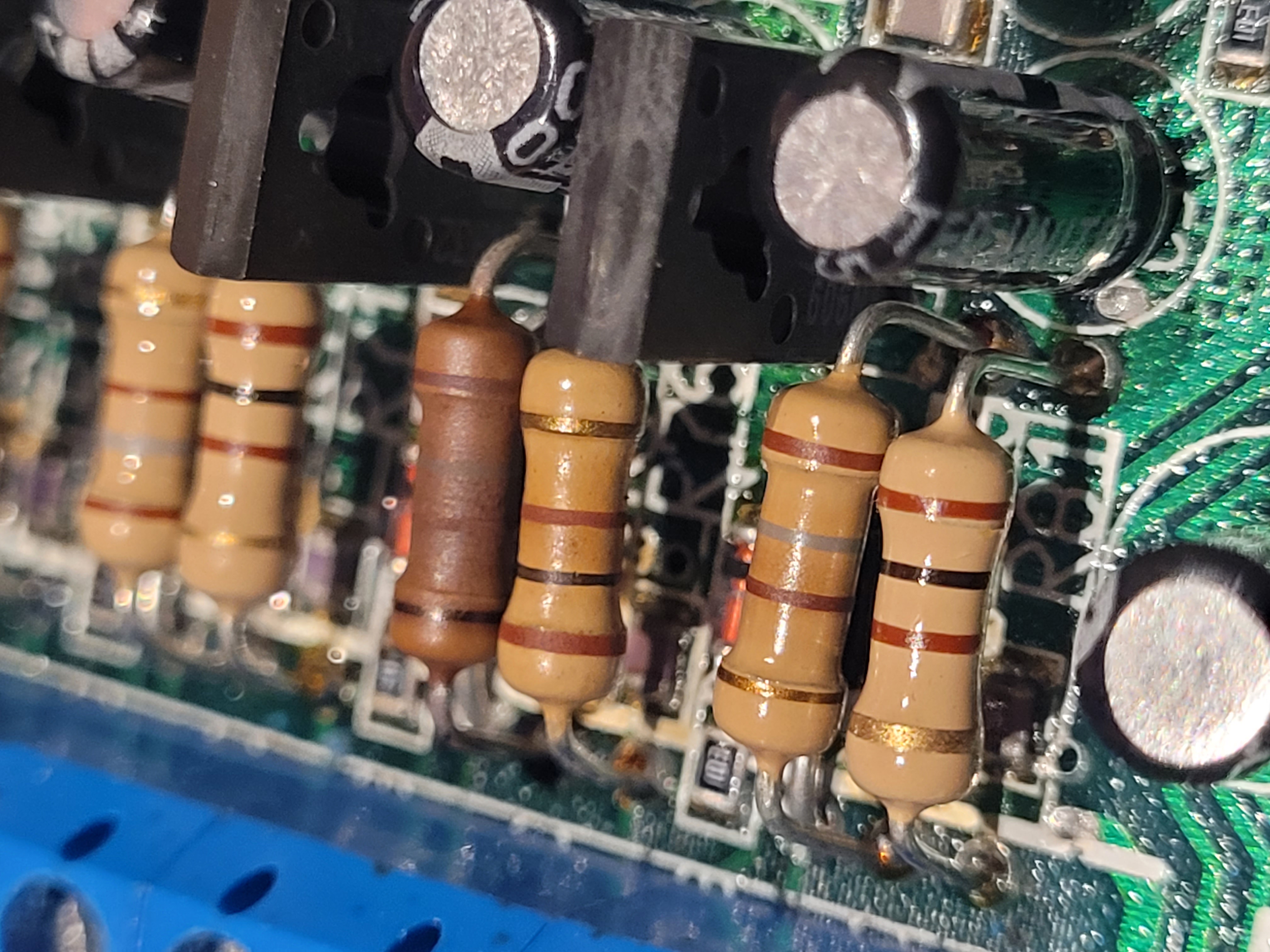 Extension interface resistors showing heat discolouration on one resistor in the Extension 15 circuit