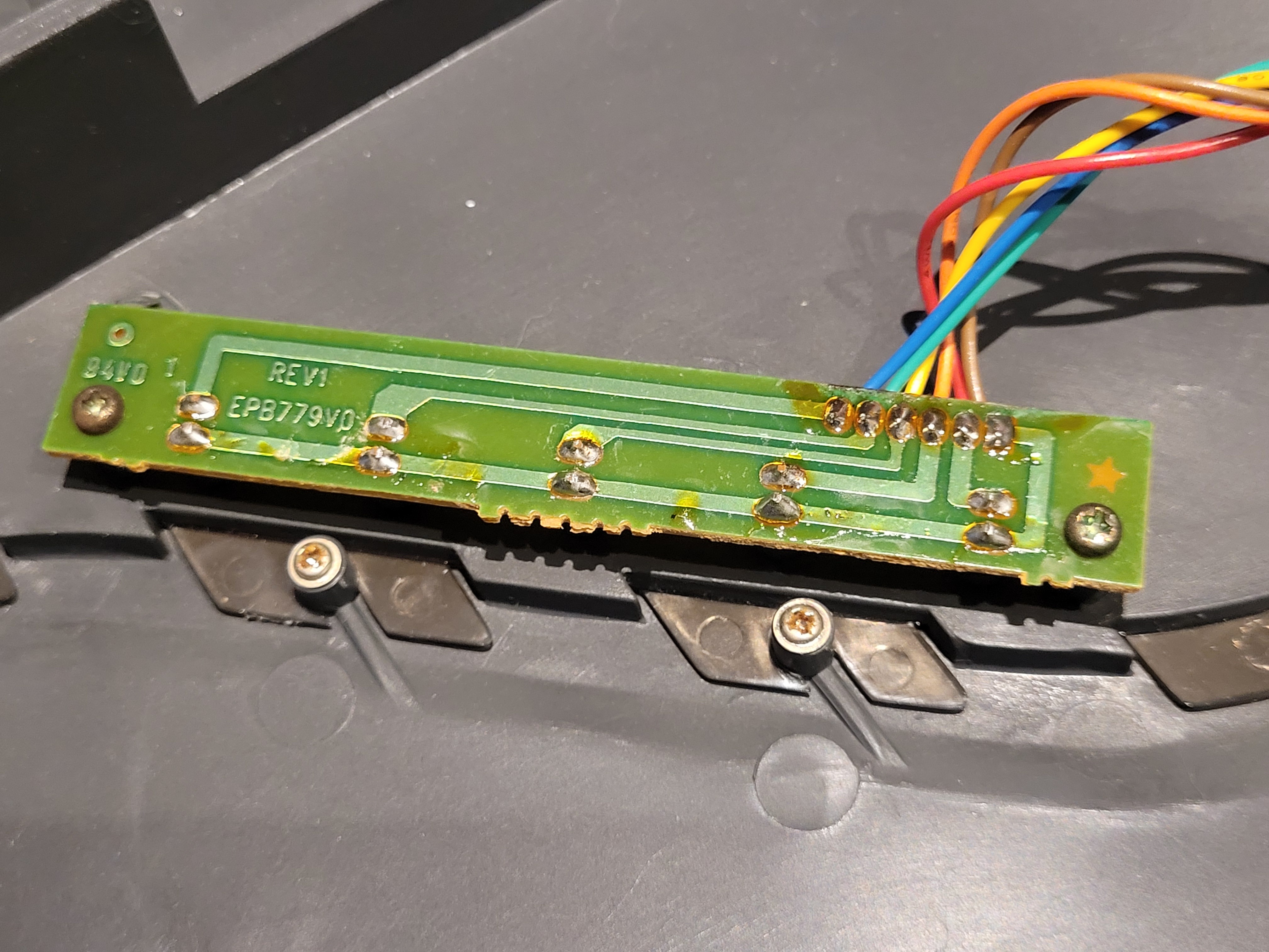 The LED daughter board (EPB779V0 REV1) mounted in the front panel with multicore cable attached